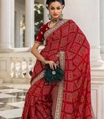 red bandhani printed saree with unstitched blouse piece
