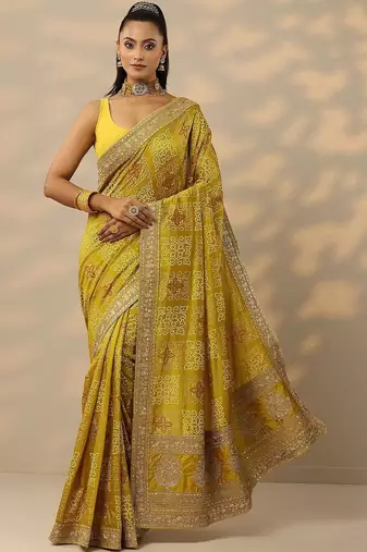 yellow printed banarasi saree with unstitched blouse piece