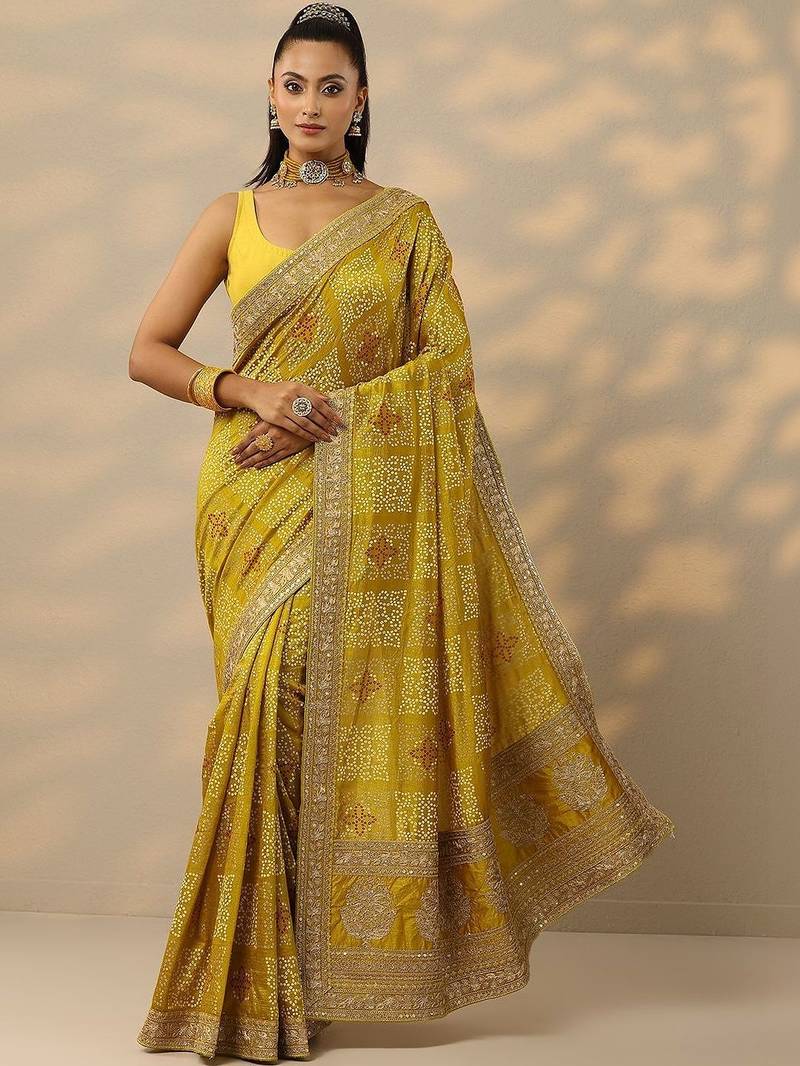 yellow printed banarasi saree with unstitched blouse piece