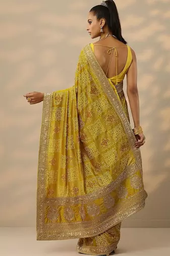 yellow printed banarasi saree with unstitched blouse piece