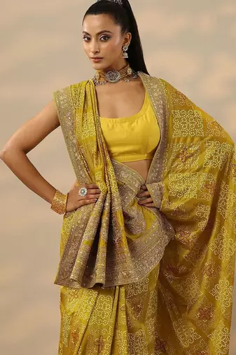 yellow printed banarasi saree with unstitched blouse piece