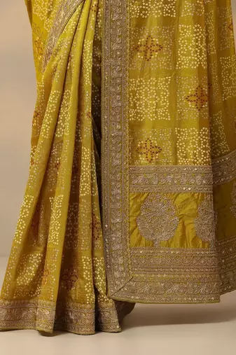 yellow printed banarasi saree with unstitched blouse piece