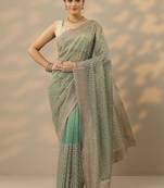 sea green embroidered nylon saree with unstitched blouse piece