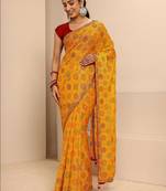 yellow bandhani printed saree with unstitched blouse piece