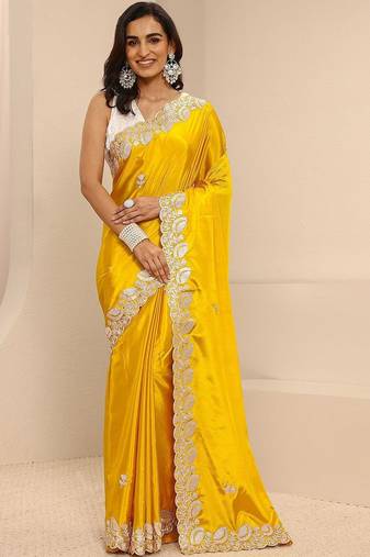 yellow embroidered saree with unstitched blouse piece