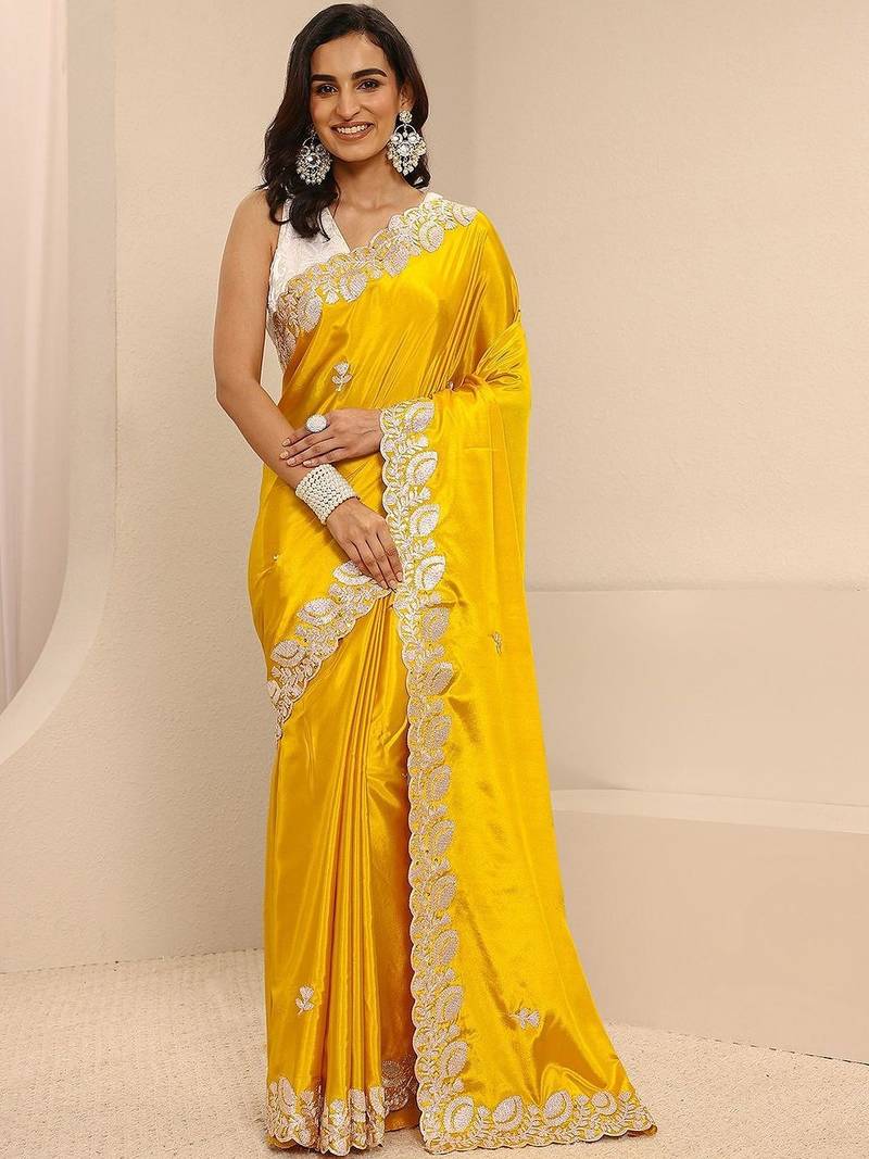 yellow embroidered saree with unstitched blouse piece