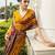 mustard printed crepe saree with unstitched blouse piece