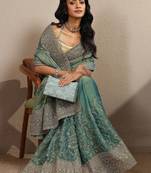 teal embroidered organza saree with unstitched blouse piece