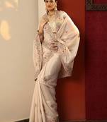 cream embroidered crepe saree with unstitched blouse piece