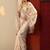 cream embroidered crepe saree with unstitched blouse piece