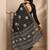 black printed georgette saree with unstitched blouse piece