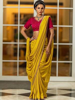 yellow sequinned silk blend saree 1