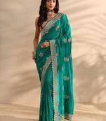teal embellished saree with unstitched blouse piece