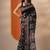 black printed saree with unstitched blouse piece