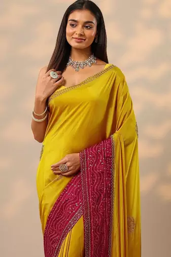 yellow embellished crepe saree with unstitched blouse piece