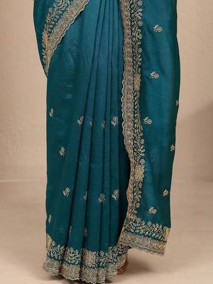 teal floral zari embroidered saree with zari embellished border and a blouse piece 2