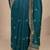 teal floral zari embroidered saree with zari embellished border and a blouse piece