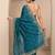teal floral zari embroidered saree with zari embellished border and a blouse piece
