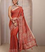 rust ethnic motif woven design saree with unstitched blouse piece