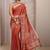 rust ethnic motif woven design saree with unstitched blouse piece