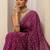 purple floral motif printed saree with embellished border and a blouse piece