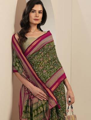 green printed saree with unstitched blouse piece 1