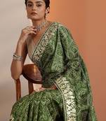 green bandhani printed chinon saree with unstitched blouse piece