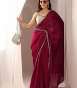 maroon embellished border satin saree with unstitched blouse piece and waistbelt