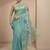 teal ethnic motif beads embellished saree with embellished border and a blouse piece