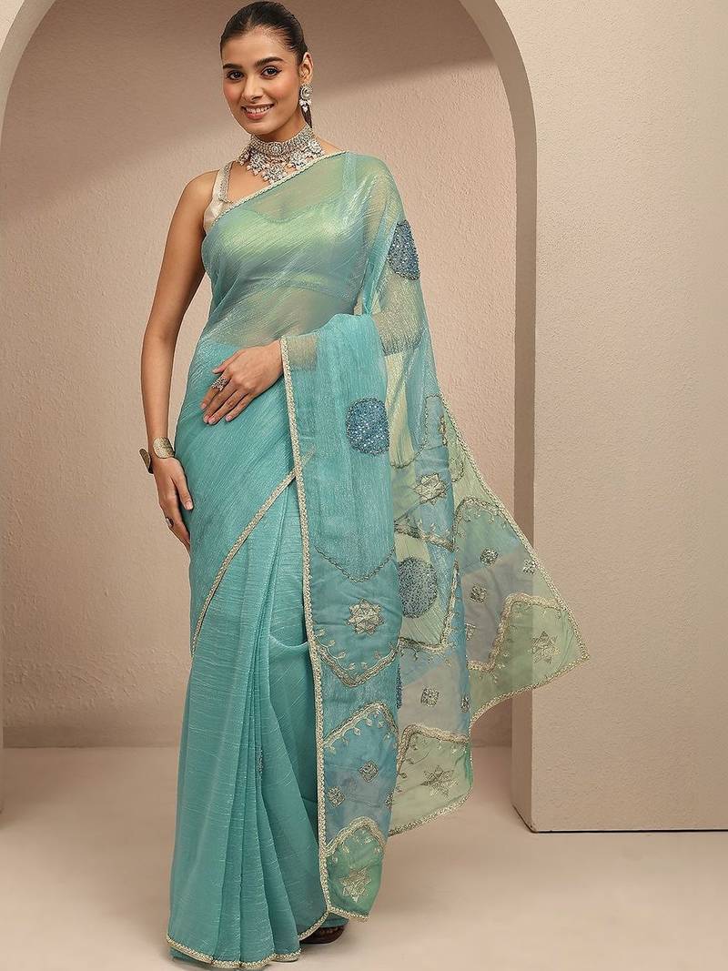 teal ethnic motif beads embellished saree with embellished border and a blouse piece