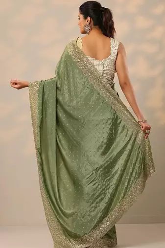 green embellished crepe sarees with unstitched blouse piece
