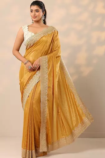 yellow embellished crepe sarees with unstitched blouse piece