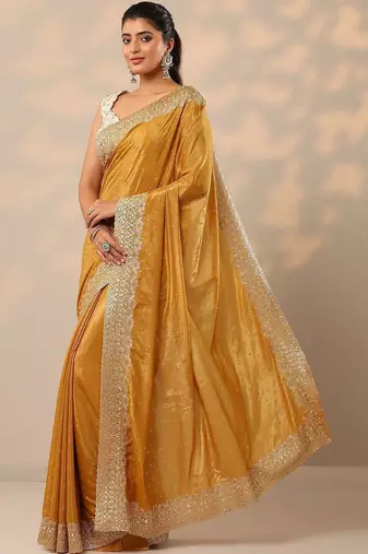 yellow embellished crepe sarees with unstitched blouse piece