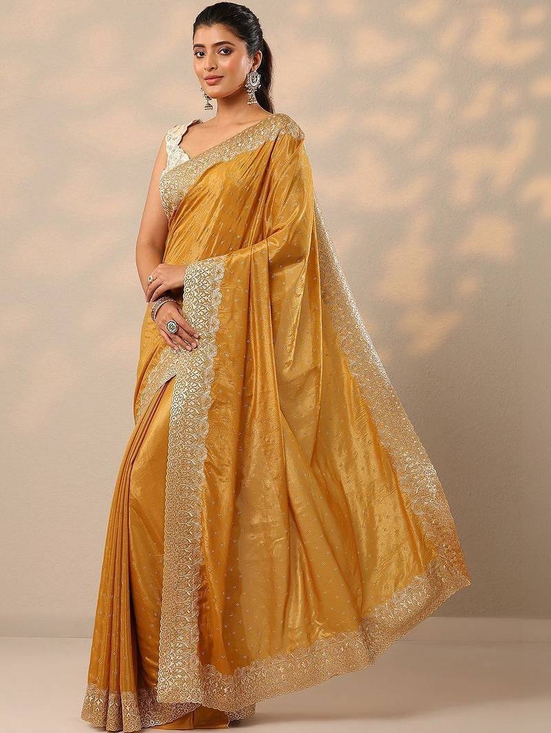 yellow embellished crepe sarees with unstitched blouse piece