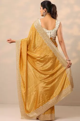yellow embellished crepe sarees with unstitched blouse piece