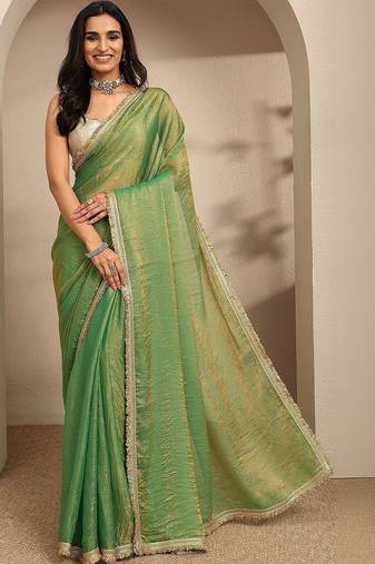 green beads embellished saree with zari embellished saree and a blouse piece