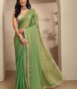 green beads embellished saree with zari embellished saree and a blouse piece