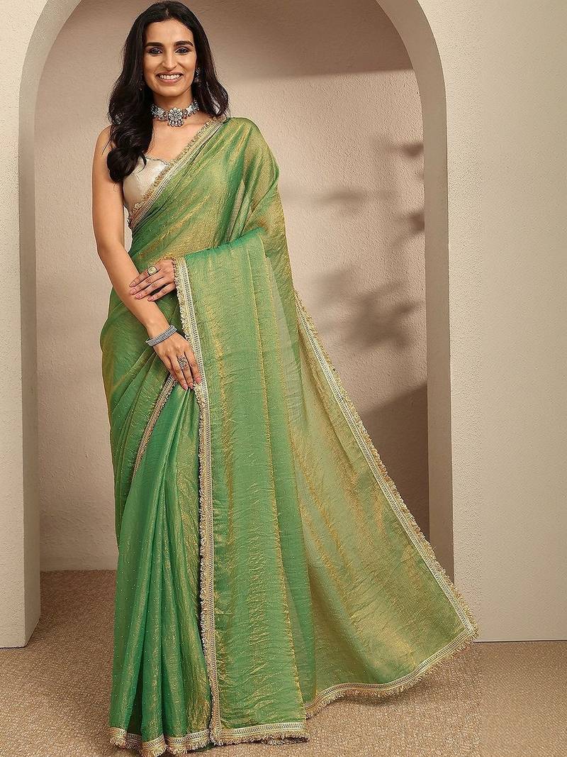 green beads embellished saree with zari embellished saree and a blouse piece