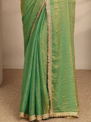 green beads embellished saree with zari embellished saree and a blouse piece 3
