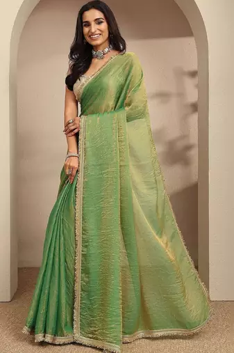 green beads embellished saree with zari embellished saree and a blouse piece