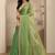 green beads embellished saree with zari embellished saree and a blouse piece