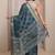 teal floral woven design saree with unstitched blouse piece