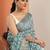 teal printed saree with unstitched blouse piece