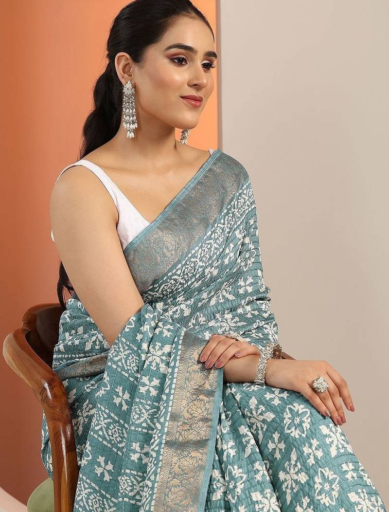 teal printed saree with unstitched blouse piece