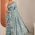 teal printed saree with unstitched blouse piece