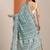 teal printed saree with unstitched blouse piece