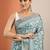 teal printed saree with unstitched blouse piece