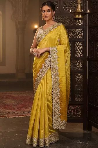 yellow embellished crepe saree with unstitched blouse piece
