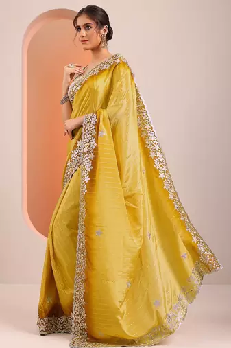 yellow embellished crepe saree with unstitched blouse piece