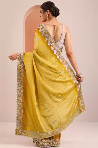 yellow embellished crepe saree with unstitched blouse piece
